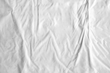 Plastic texture with wrinkles and folds, isolated transparent background. Crumpled synthetic surface for design, packaging and overlay