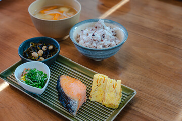Traditional Japanese breakfast with grilled salmon and miso soup
