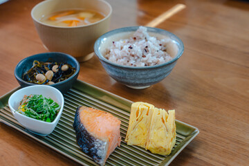 Traditional Japanese breakfast with grilled salmon and miso soup
