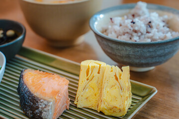 Traditional Japanese breakfast with grilled salmon and miso soup
