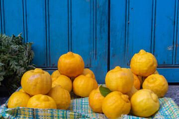 Morocco, Africa: the Blue City, lemons for sale at the market in the alleys of the medina of Chefchaouen (Chaouen), city founded in 1471, famous for its buildings in shades of blue 
