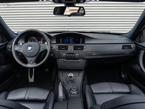 BMW M3 E90 interior cockpit and M-DCT shifter, German V8 sports sedan driver environment

