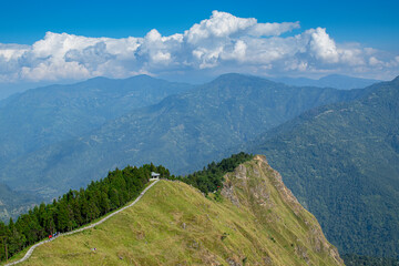 Fototapeta premium Tarey Bhir point,favourite tourist spot, Sikkim,India. A long path on the hills, a breathtaking viewpoint at the end of the edge, tourists get spectacular view of Himalayan mountains in front of them.