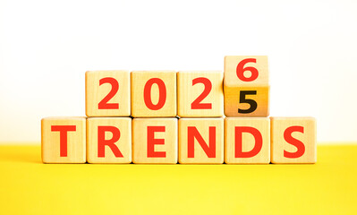 2026 Trends new year symbol. Concept words 2026 Trends on beautiful wooden blocks. Beautiful white and yellow paper background. Business 2026 Trends new year concept. Copy space.