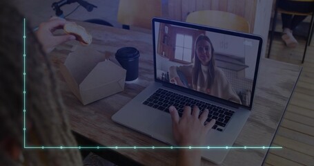 Man typing and eating pastry at cafe, with laptop call showing colleague, coffee cup, bicycle frame