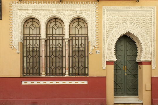 Seville, Spain, Europe. Beautiful grand entry door featuring Moorish architecture. 