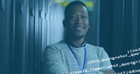 Standing engineer wearing sweater and badge in data center corridor, server racks and code overlay