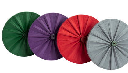 Four colorful, circular objects resembling folded paper or fabric fans on a black background