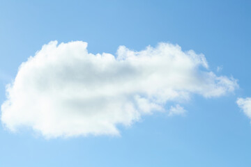 Cumulus cloud over wooded hill, blue sky, scenic view

