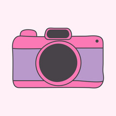 A bright and colorful, cartoon-style icon of a camera. The camera is pink and purple, featuring a playful design that represents travel, photography, and perhaps environmental documentation.