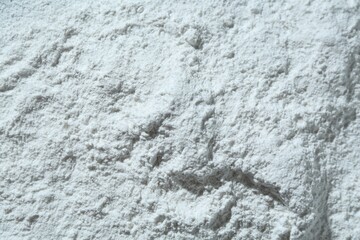 Texture of dry talcum powder as background, top view