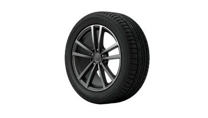 Modern car wheel with silver spokes and a black tire, set against a black background