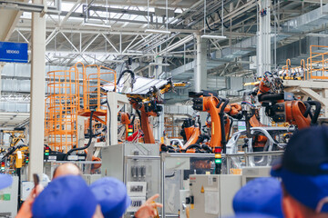 Automotive production line. Robotic Welding car body. Modern car Assembly plant