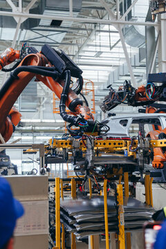 Automotive production line. Robotic Welding car body. Modern car Assembly plant
