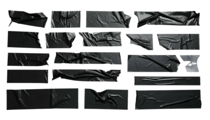 Various sized, textured black tape pieces arranged on a dark background, slightly crumpled