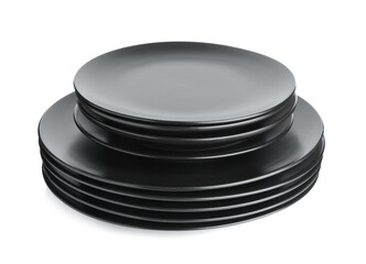 Stack of black ceramic plates isolated on white
