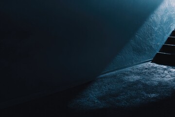 Moody blue-toned interior, highlighting textured walls and shadows near a stairway