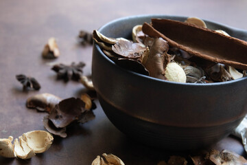 a bowl of potpourri, which is a mixture of dried, natural plant materials used to provide a pleasant scent or visual decoratio