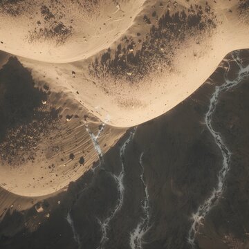 An abstract, high-contrast aerial view of a dramatic desert landscape where a massive, sweeping sand dune or barchan shape in golden beige sharply divides the composition. The lower section is dominat