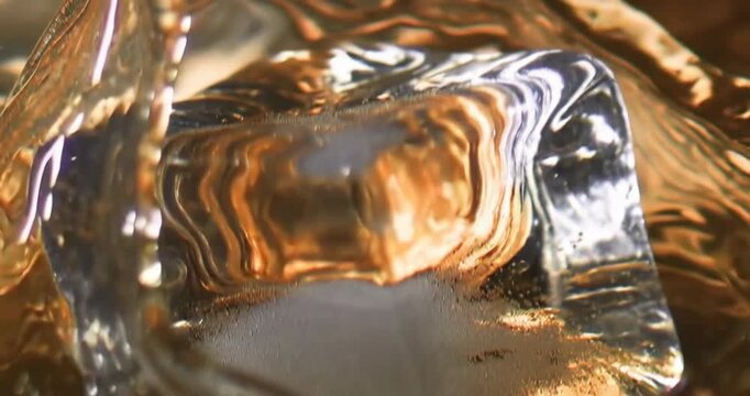 AI-Generated Elegant close-up of golden whiskey swirling over crystal ice cubes, rich amber tones and rising bubbles capturing sophistication, warmth, and indulgence ideal for premium alcohol branding