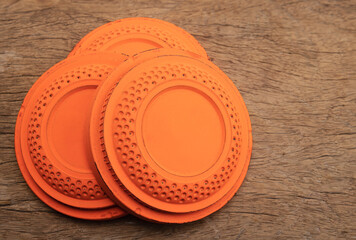 Flying clay pigeon target on wooden background , shooting game