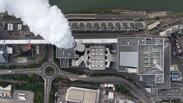 Coal fired power plant, top down aerial drone video. Smokestack, chimney. Mannheim, Germany.