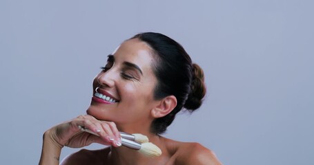 Studio, face and woman with makeup brush, beauty and confident with tool, makeover and mockup space. Purple background, laughing and mature person with smile for cosmetics application or happy in USA - Powered by Adobe