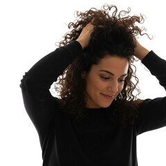  woman with curly hair styling her hair at home for beauty and self care routine portrait shot on transparent background