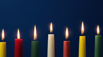 Photoreal overhead view of a row of multicolored tapered candles with glowing flames on deep blue seamless background, showcasing wax texture and festive joy