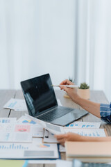 Fototapeta premium Businesswoman Analyzing Financial Data on Laptop
