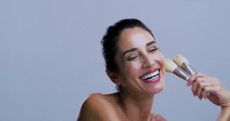 Laughing, woman and makeup brush for glow, face and confident with tool, powder on studio background. Mockup space, happiness and mature person with smile for foundation application or cosmetics - Powered by Adobe