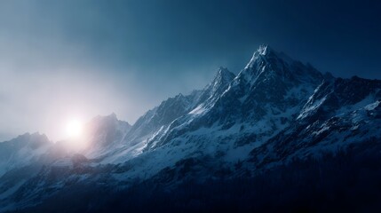 Obraz premium Majestic snow capped mountain range illuminated by a radiant sunrise casting dramatic shadows across the alpine peaks