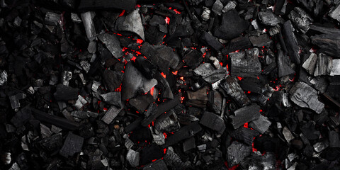 Glowing hot charcoal. Top view. Free space for text.