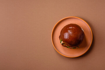 A burger, a hamburger with cheese, beef, and a bun, is unhealthy takeaway food. A burger