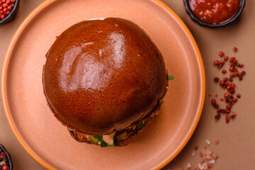 A burger, a hamburger with cheese, beef, and a bun, is unhealthy takeaway food. A burger