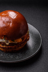 A burger, a hamburger with cheese, beef, and a bun, is unhealthy takeaway food. A burger