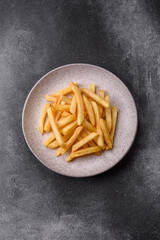 French fries are salty, crispy, and fried in oil, unhealthy takeaway food. French fries