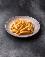French fries are salty, crispy, and fried in oil, unhealthy takeaway food. French fries