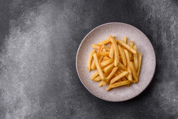 French fries are salty, crispy, and fried in oil, unhealthy takeaway food. French fries