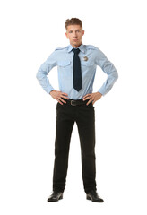 Fototapeta premium Young policeman in uniform on white background