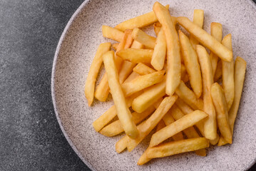 French fries are salty, crispy, and fried in oil, unhealthy takeaway food. French fries