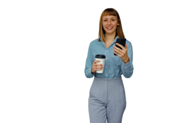 Woman smiling, holding smartphone and coffee cup, walking in business casual attire on transparent background