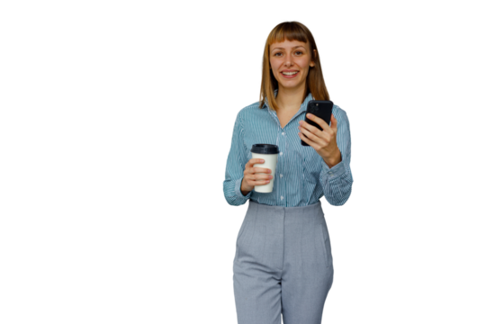 Woman smiling, holding smartphone and coffee cup, walking in business casual attire on transparent background