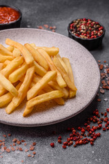 French fries are salty, crispy, and fried in oil, unhealthy takeaway food. French fries