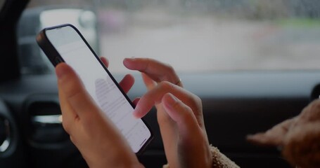 Hands using a smartphone inside a car, touchscreen interaction on a mobile device. Modern technology concept highlighting connectivity, navigation, texting, internet use, and digital lifestyle. - Powered by Adobe