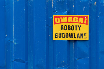 Warning Sign on Blue Metal Fence © Fotolixir
