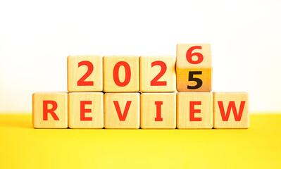 2026 Review symbol. Concept words 2026 Review on beautiful wooden blocks. Beautiful white and yellow paper background. Business and 2026 review concept. Copy space.