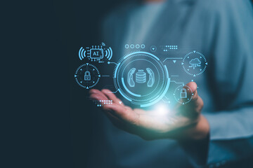 Businessman holding glowing digital interface showing data protection, AI chip, and cloud security icons, symbolizing artificial intelligence, cybersecurity and data management technology.