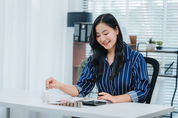 Investing in the future: A woman makes a strategic decision to save for future goals, carefully...