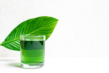 Liquid Chlorophyll Drink. Glass of Green Chrorophyll Water.
